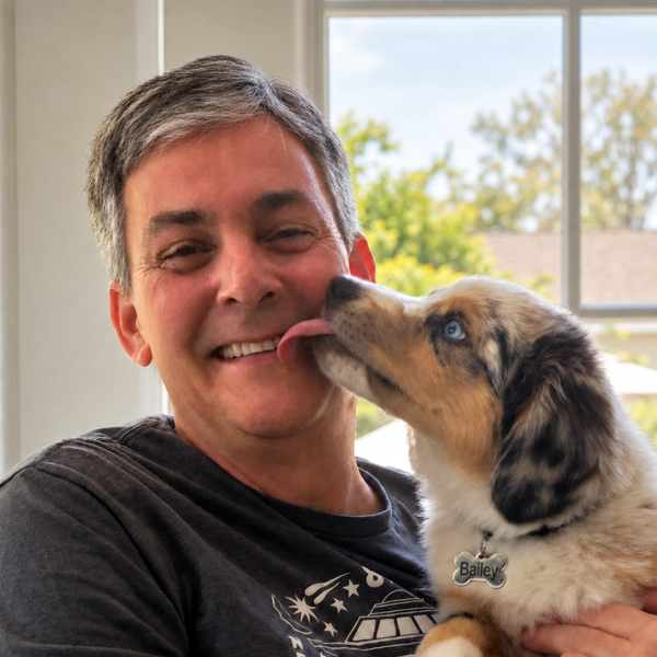 Photo of Peter Tisa bed head and puppy Bailey